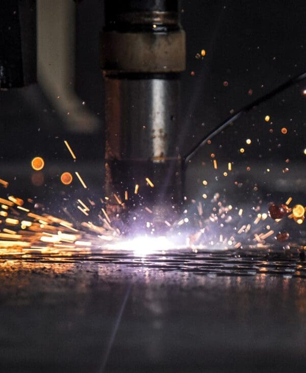 Metal fabrication worker grinding or finishing steel
